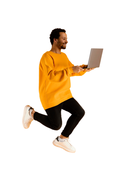 portrait-young-man-jumping-with-laptop